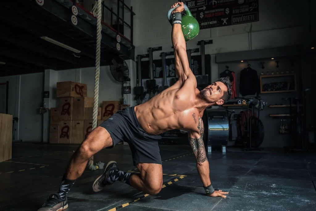 A man doing exercise with kettlebell 