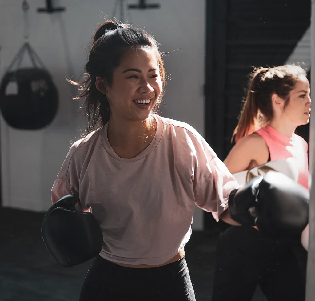 Two girls are training boxing