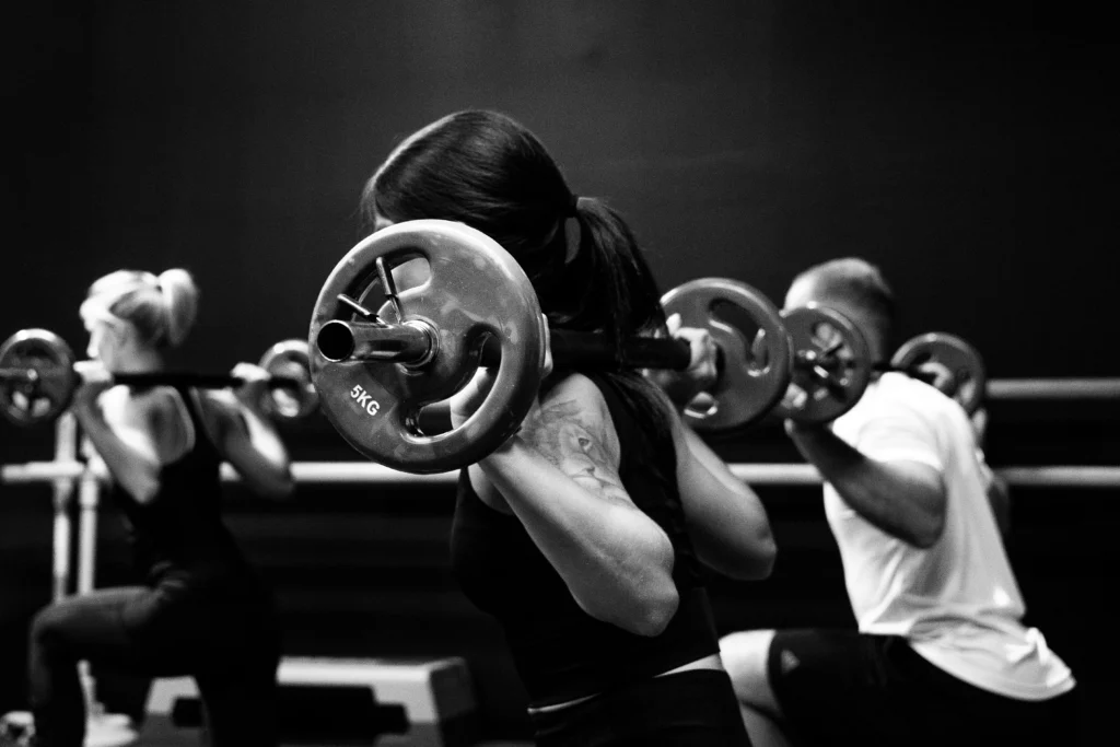 Group of people doing Strength training exercise 