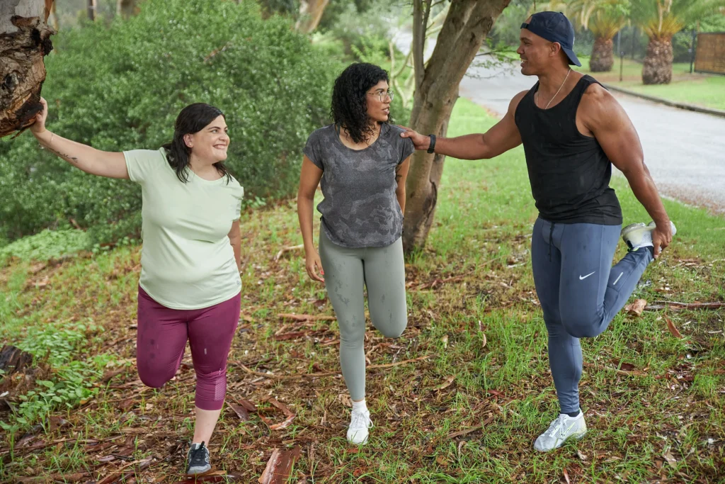 Smiling duo exercises together, text 'Celebrate your body's abilities' - Exercise with friends