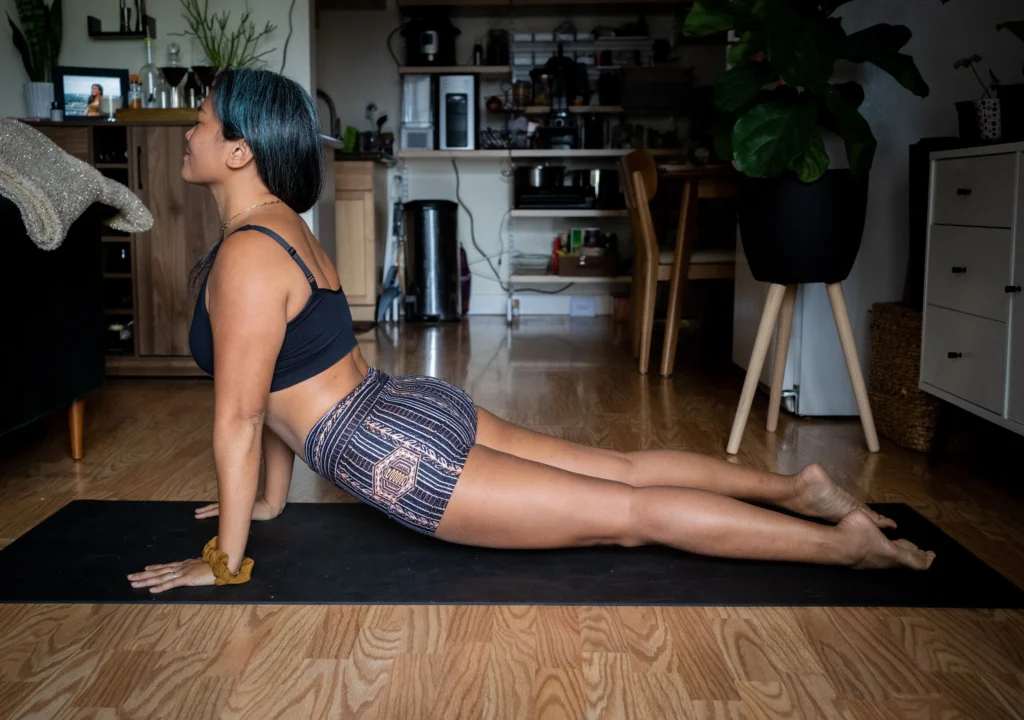 Woman performing home workout, promoting fitness from home