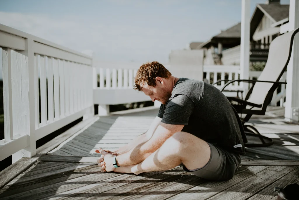 Man stretching in post-workout cool-down