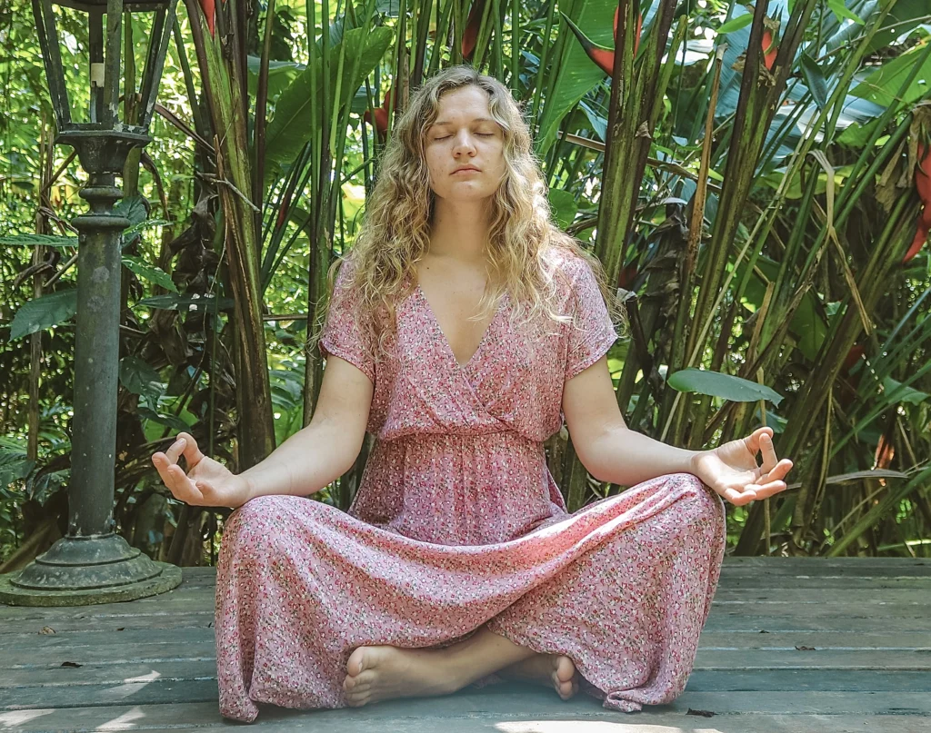 Girl meditating in Gyan Mudra (thumb and index finger touching)