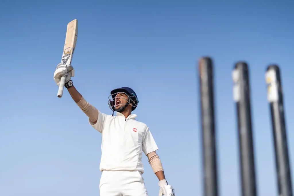 High school student playing cricket