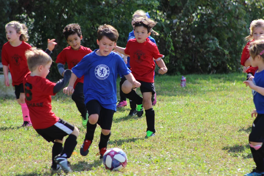 Elementary school students playing football