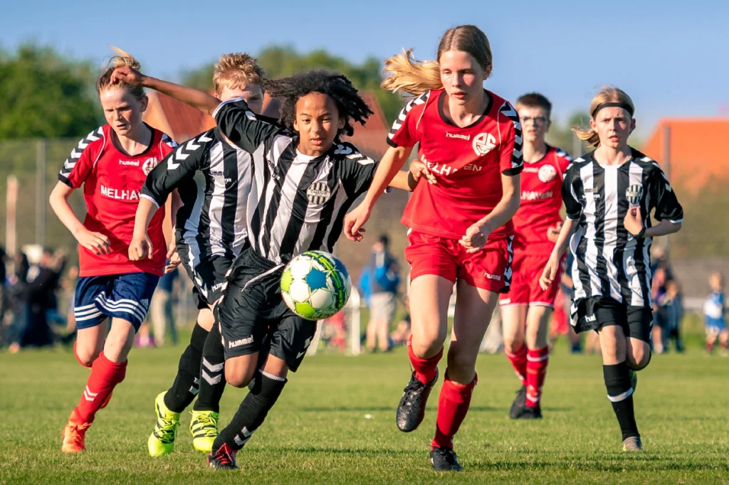 Middle school students playing football 