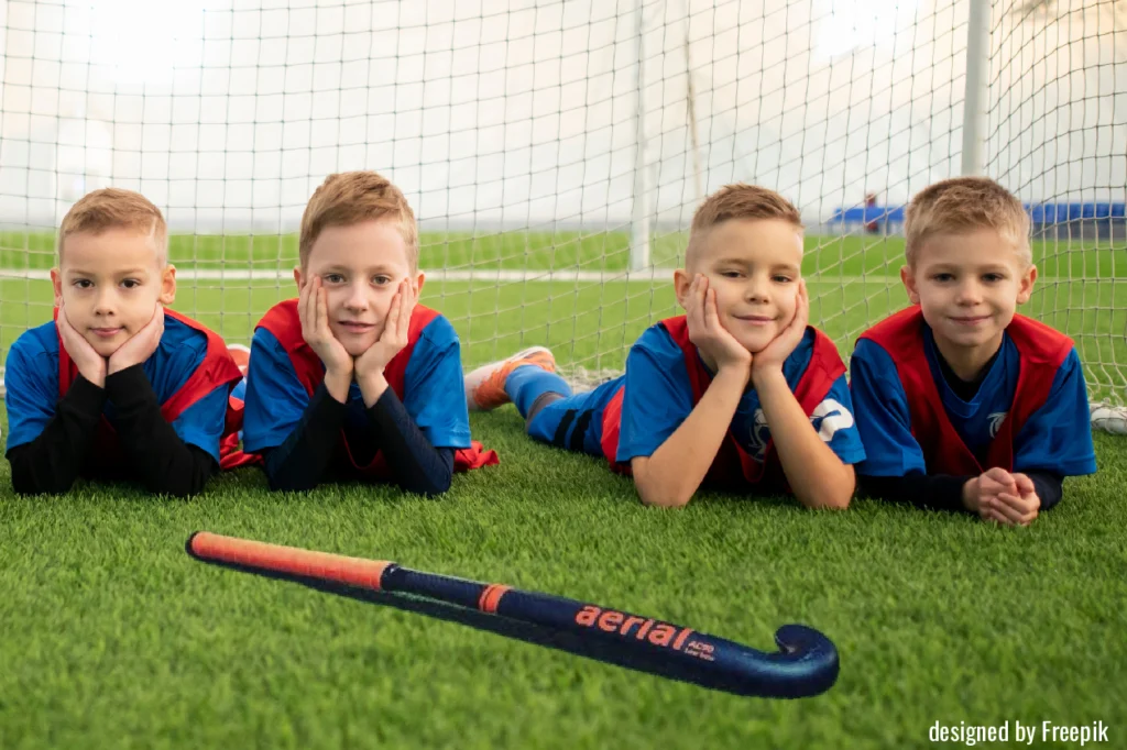 Elementary School level players with hockey stick